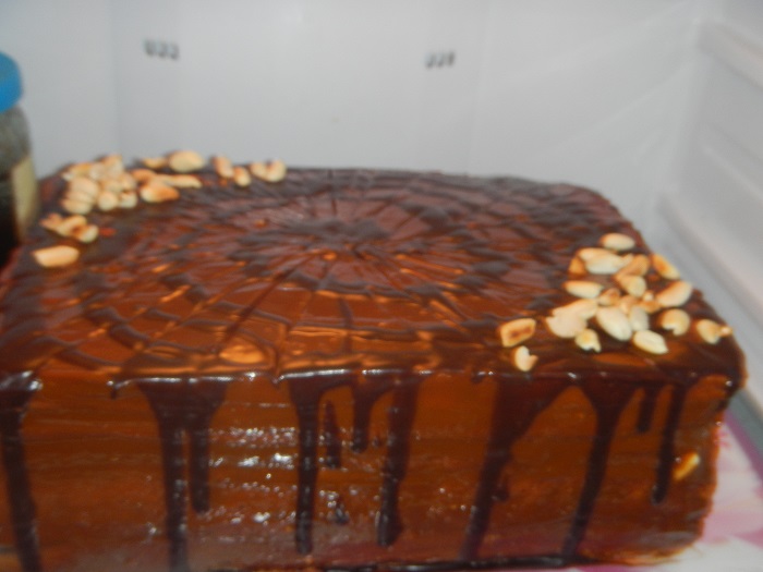 Honey cake with sour cream with condensed milk and nuts