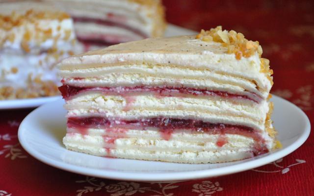 Pancake cake with cream and cottage cheese cream and cherry jam