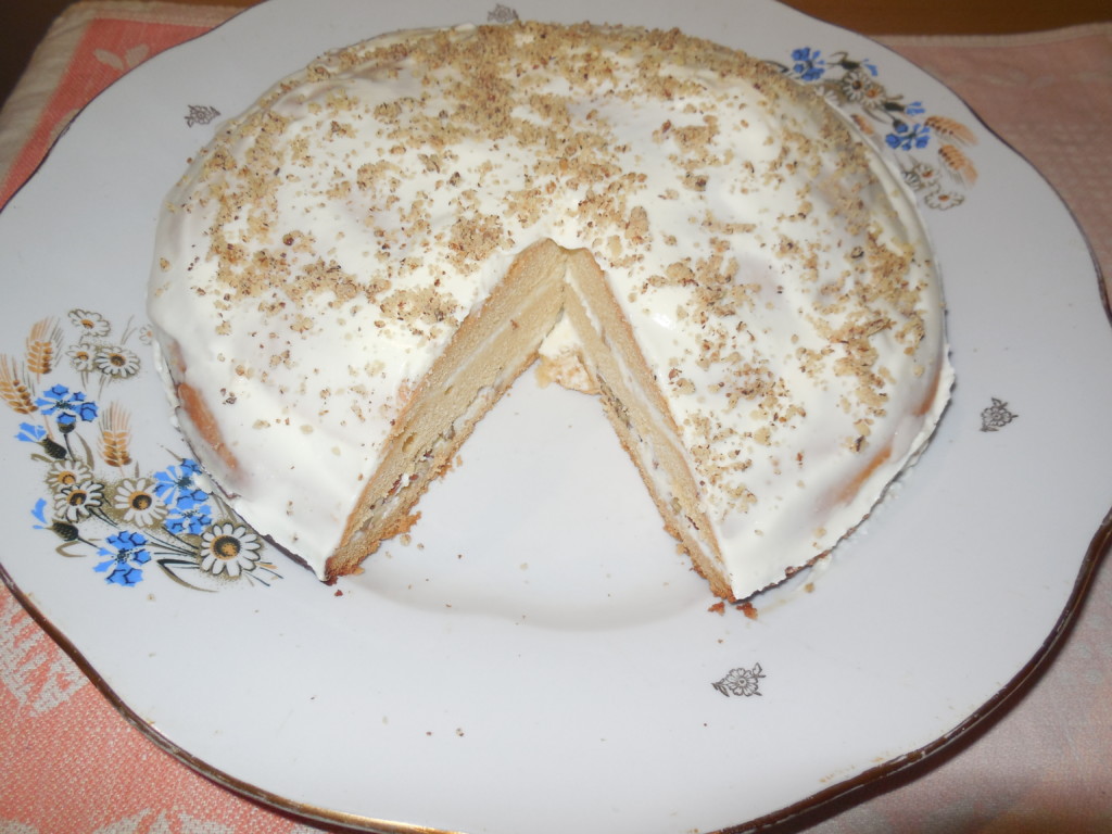 Honey cake with curd cream and walnuts 