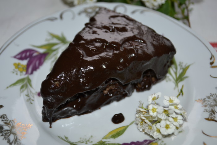 Jewish cake with cherries, nuts and chocolate icing