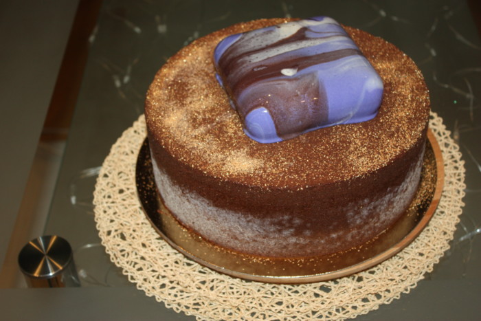 Mousse-biscuit cake with fruit and velor coating