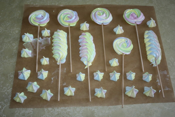 Colored meringue on a stick - protein decoration for cake and candy bar