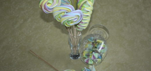 Colored meringue on a stick - protein decoration for cake and candy bar